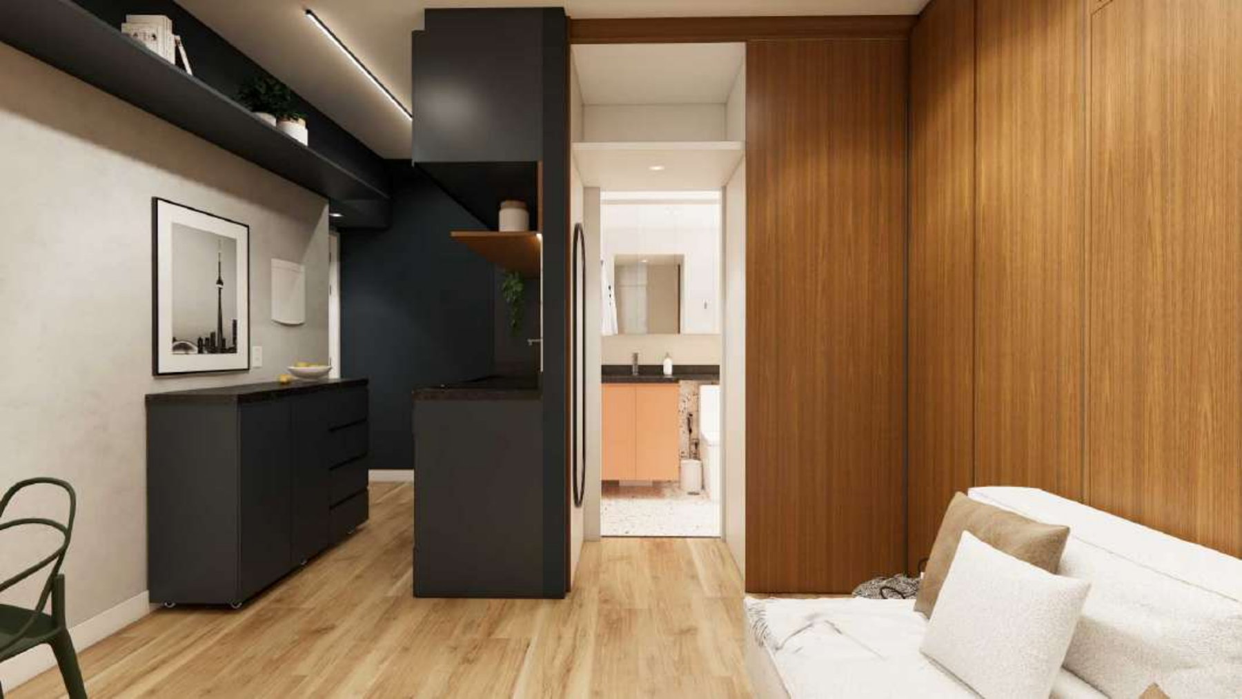 Imagem 3D da vista geral do studio: parede da TV, armário-balcão, cozinha e porta do banheiro aberta ao fundo